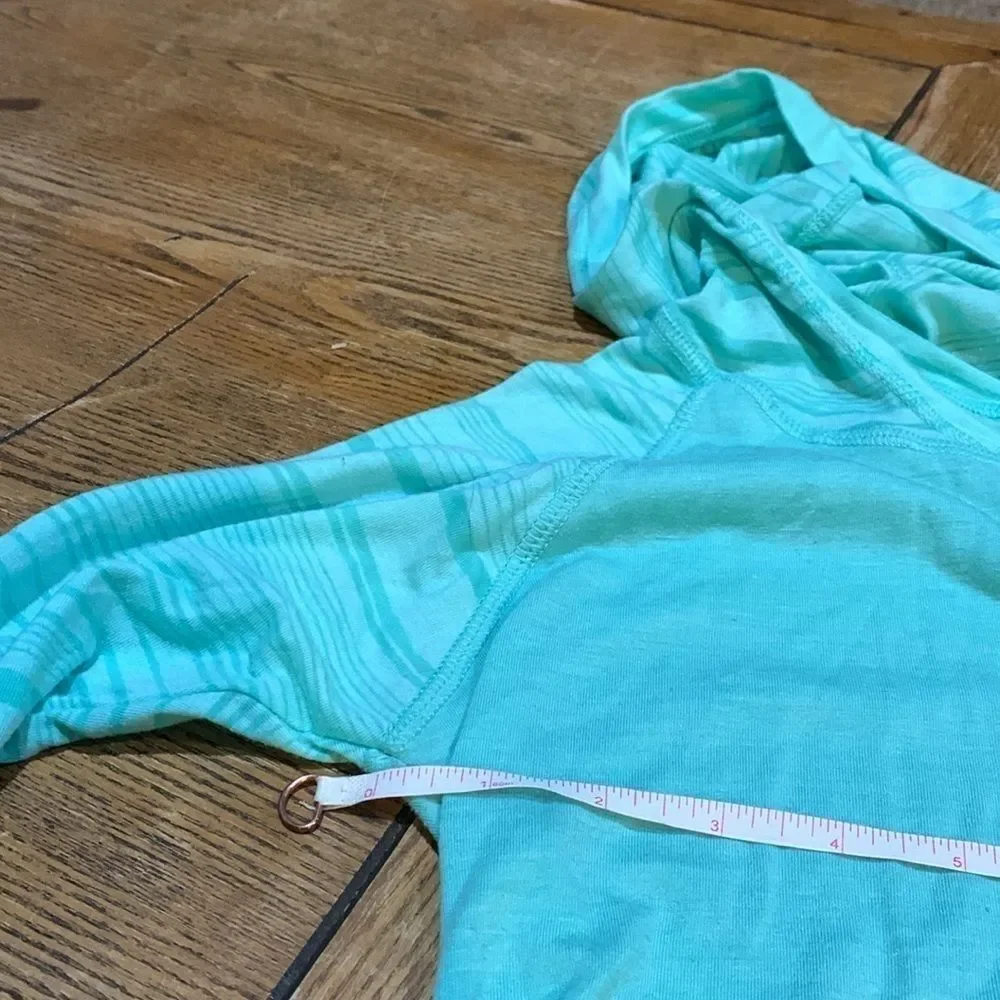 Girls small teal hooded shirt with black small stretchy shorts in box 11